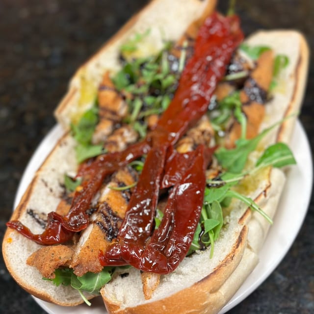 New Chicken Hero fresh Mozzarella,Sundried Peppers, Arugula, Balsamic Glaze.